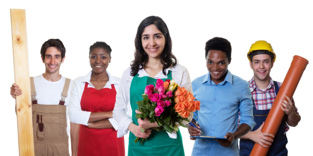 Specialized Youth Programs and Services - Laughing florist with group of other international apprentices on an isolated white background.